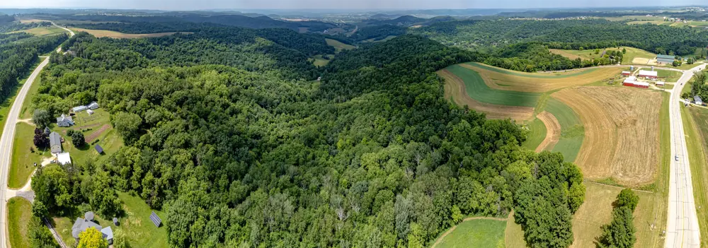 Contour-strip farm fields and wooded ridges in the Driftless Area